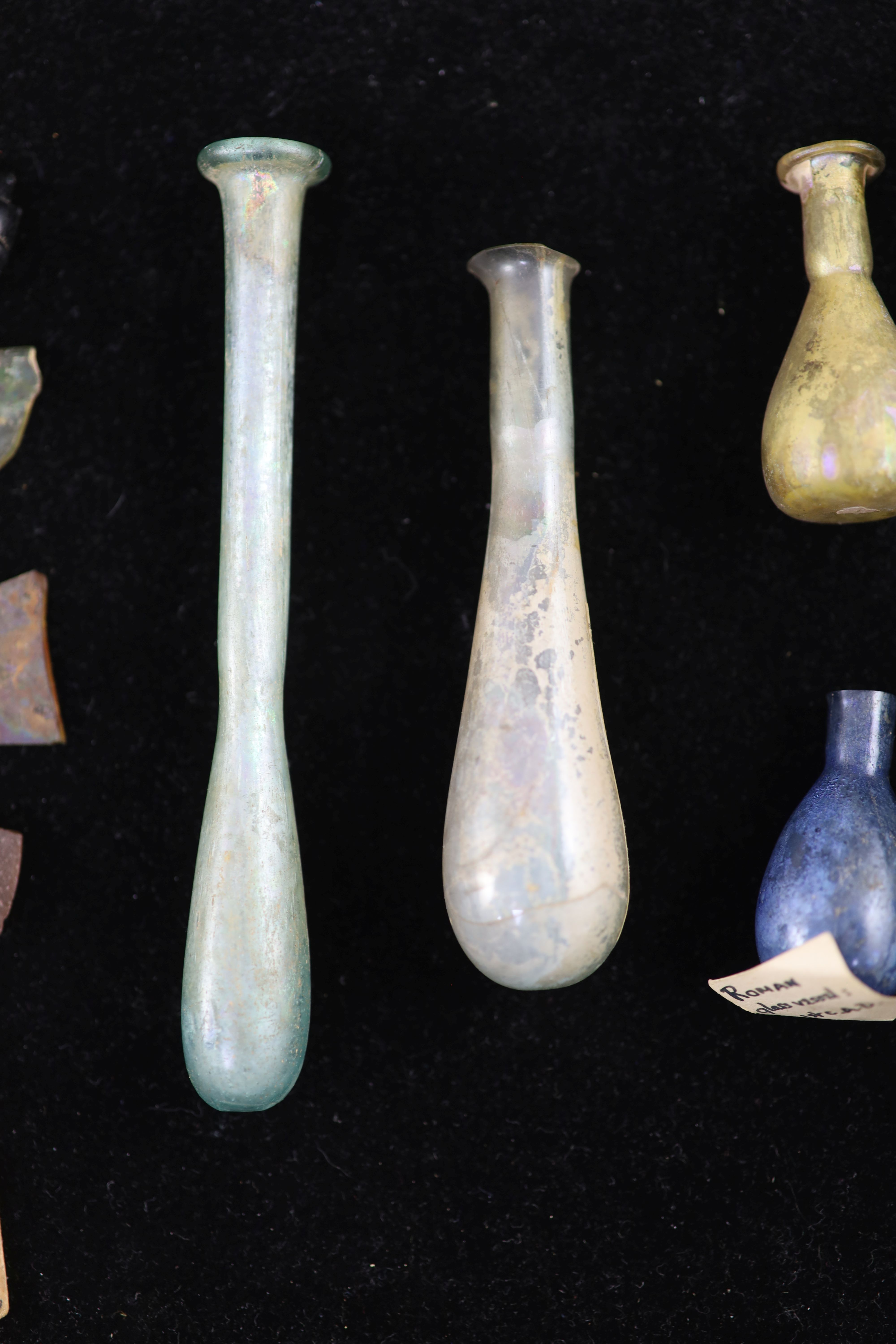 A group of three Roman glass vessels and Egyptian/Roman glass fragments, Provenance - A. T. Arber-Cooke